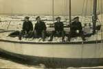 87. ID JAY_D17_001 Sitting on the yacht BIDDY in the snow.
L-R George French, Ted Vince, Joe Hempstead, Alf Hempstead
Cat1 Mersea-->Old City & the Hard Cat2 Families-->French Cat3 Families-->French Cat4 People-->Fishermen and Seamen