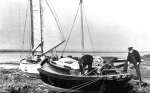 79. ID RG27_353 Fitting out at West Mersea, 1939. William Wyatt stands, rule in hand, while the covers come of the 40-foot cutter FLORENCE in the mud-berths at the Old City ...
Cat1 Mersea-->Creeks, fleets, channels, saltings Cat2 Yachts and yachting-->Sail-->Larger Cat3 Yachts and yachting-->Sail-->Larger