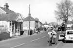 11734. ID HWC_AB2_051 Looking north up High Street from Cock, butchers. Mary Chapman on bike. Jeffery's shop on the left.
Cat1 Mersea-->Road Scenes Cat2 Mersea-->Shops & Businesses