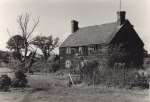  A derelict farmhouse, location unknown. There is a large farmyard in the distance to the left.  UPA_073_001