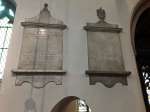  William Mayhew and William Mayhew, father and son. Tablets on the south wall in the chancel of St Leonard's Church at the Hythe in Colchester.
</p><p>
On the left reads:
 In a Vault near this place
 are deposited the remains of
 Wm. Mayhew Esqr.
 One of the Aldermen of this Borough.
 He was a chearful Companion,
 a friend to his Country
 a good Christian
 but no Bigot.
 He lived esteemed and died lamented
 by his family and friends
 upon 21st August 1764 Aged 58 Years
 leaving issue by Elizabeth his Widow
 One Son William and one Daughter Elizabeth.
 In the same Vault are placed the remains of 
 ELIZABETH MAYHEW Widow
 She died 9th October 1779 Aged 72.
 The loss of such a parent was
 irreparable to her Children
 and will ever be severely felt by her Son
 WILLIAM MAYHEW
 who ordered this Monument to be erected
 in Memory of his Father and Mother
</p><p>The tablet to the right is in memory of the son William Mayhew.  PH01_PTF_007